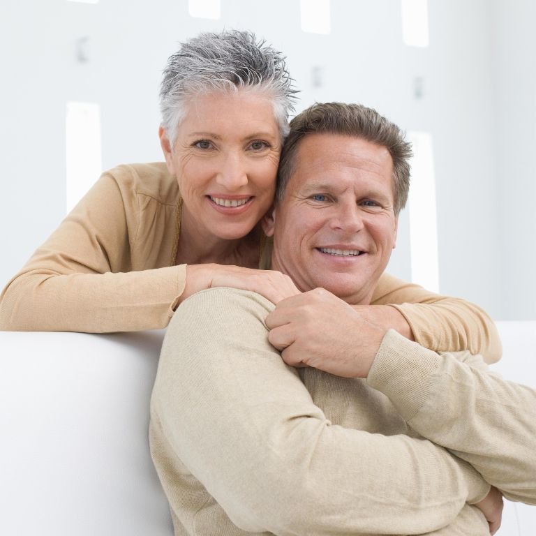 Smiling couple enjoying their new smiles